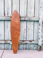 The Nui Pintail Longboard (orange/blue wheels)